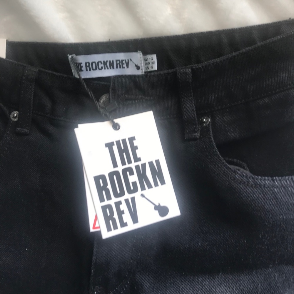 Nwt Rockn rev Black ripped jeans. Relaxed fit.